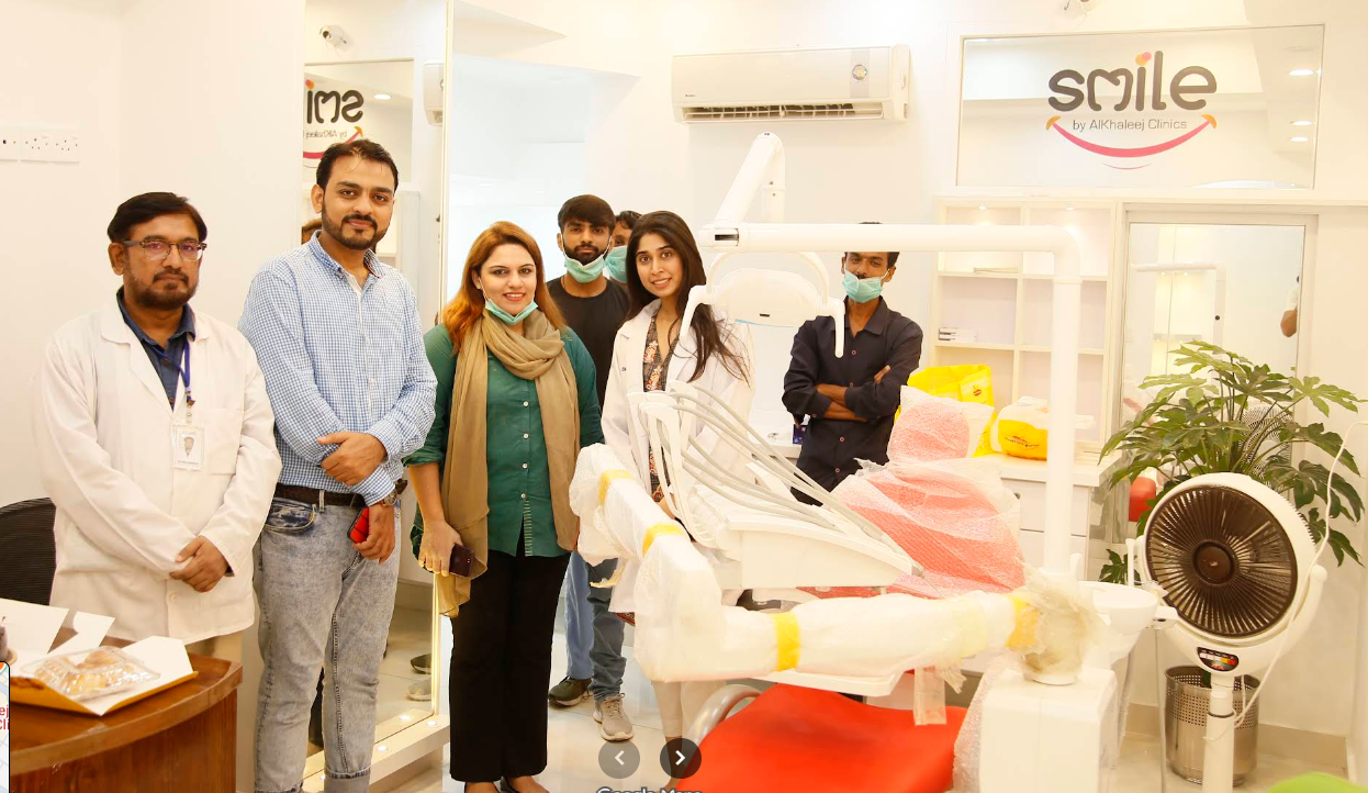 Our Dentists Our Pride – Alkhaleej Smile Clinic team with patient inside the dental clinic, Karachi